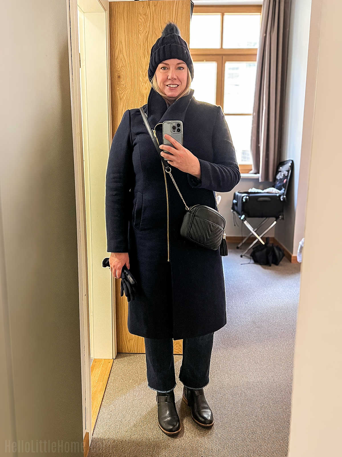 A mirror selfie of the author showing what to wear to a holiday market.