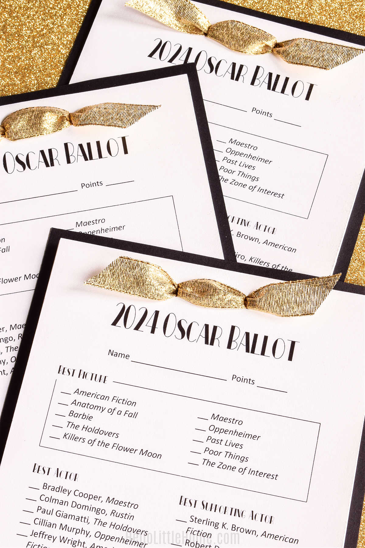 Three of the printables displayed on a gold glitter background.