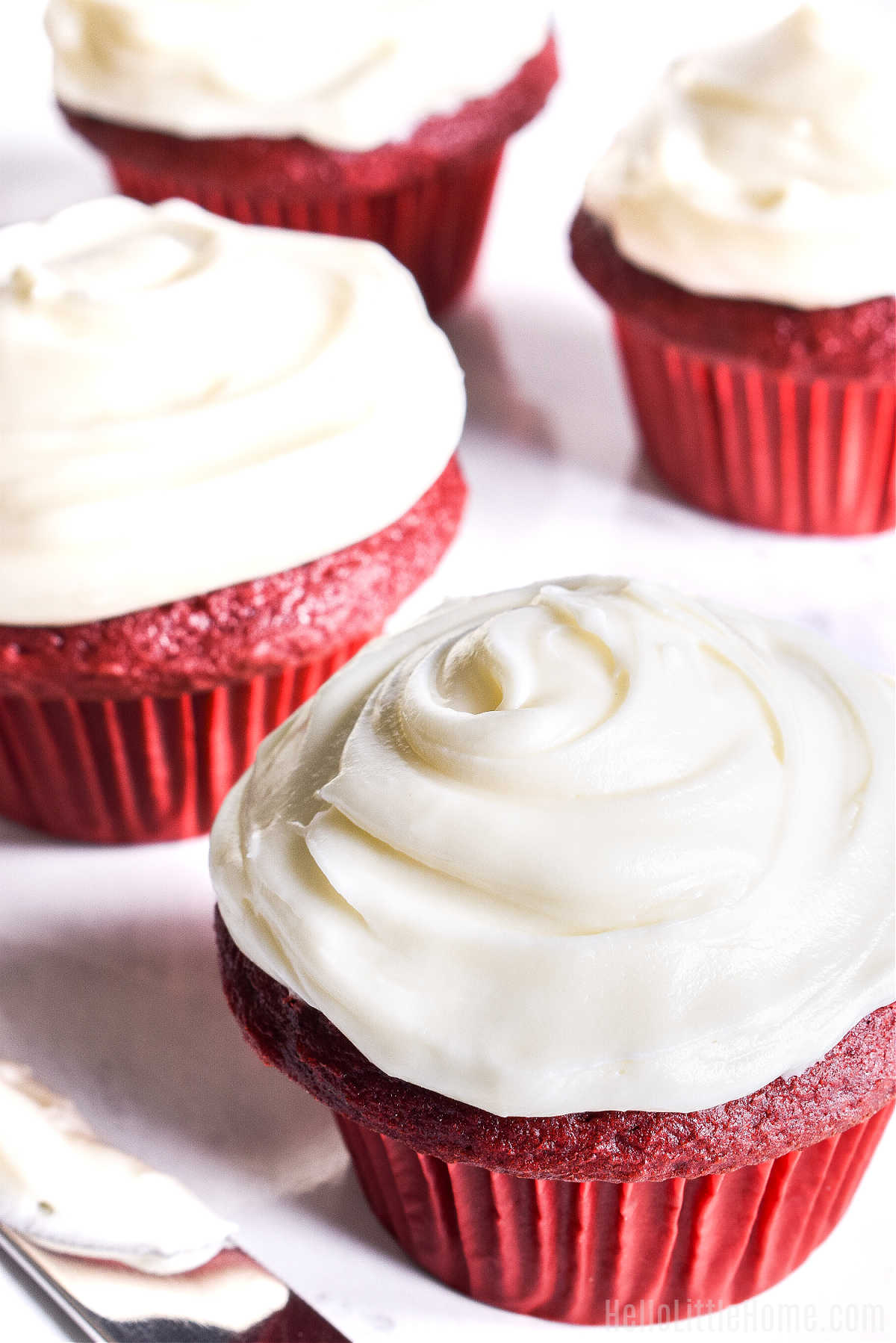 A closeup of a cupcake topped with the frosting recipe.