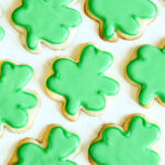 Shamrock Cookies on a marble counter.