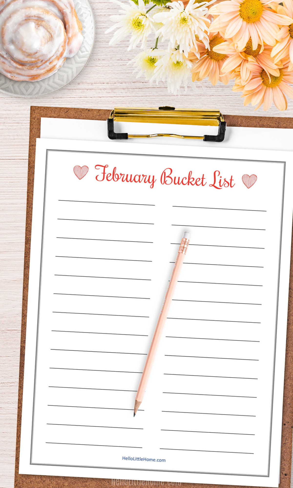 The blank list for things to do in February on a clipboard.