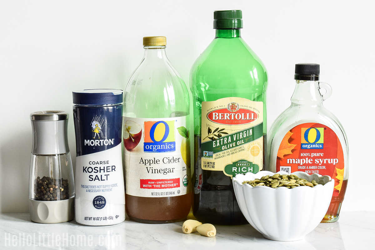 Pumpkin Seed Dressing ingredients arranged together on a marble counter.