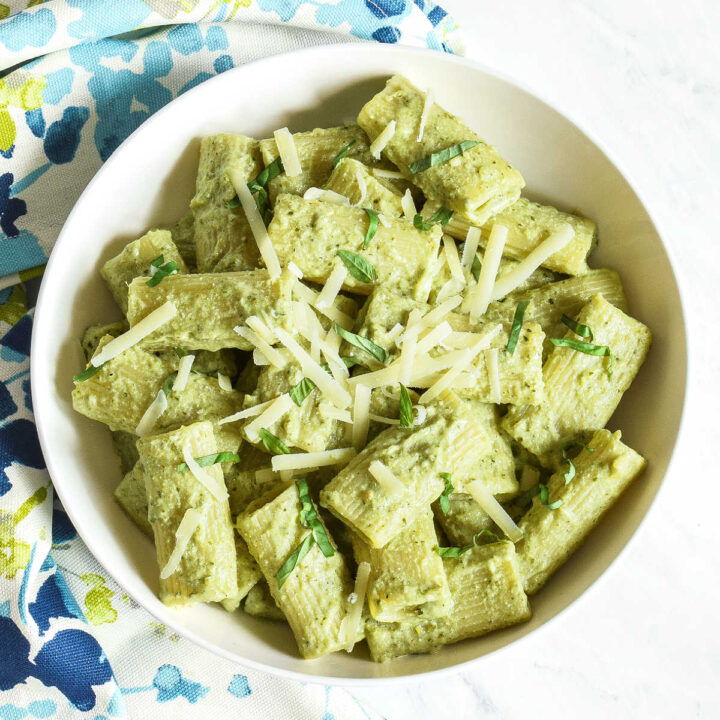 A bowl of creamy Pesto Ricotta Pasta served with a patterned napkin.
