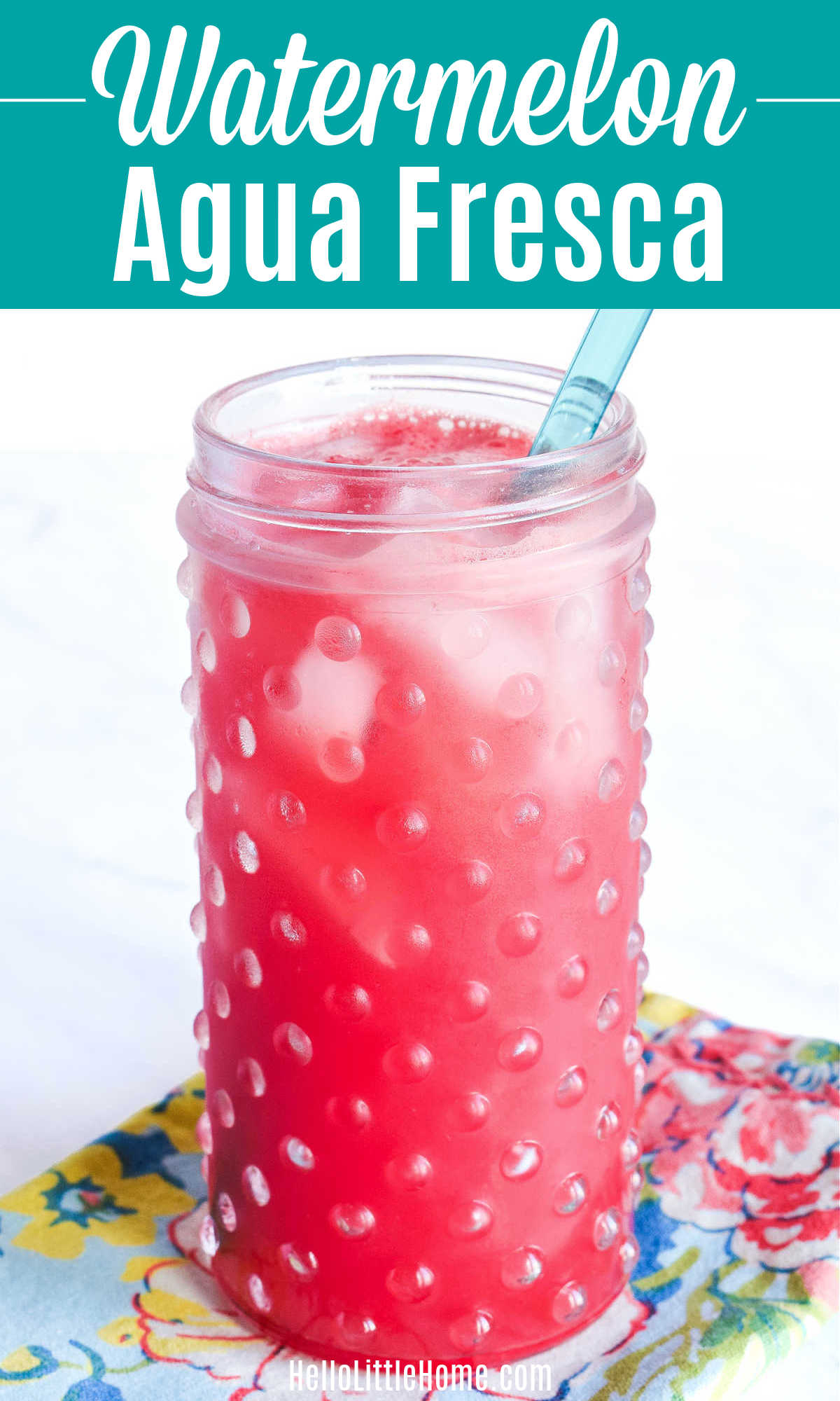 A glass of Watermelon Agua Fresca on a patterned napkin.