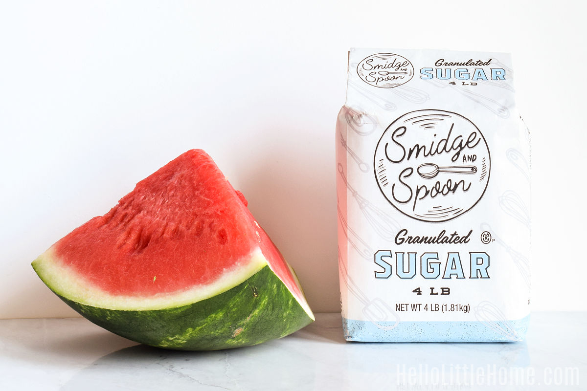 Watermelon Syrup ingredients arranged together on a marble counter.