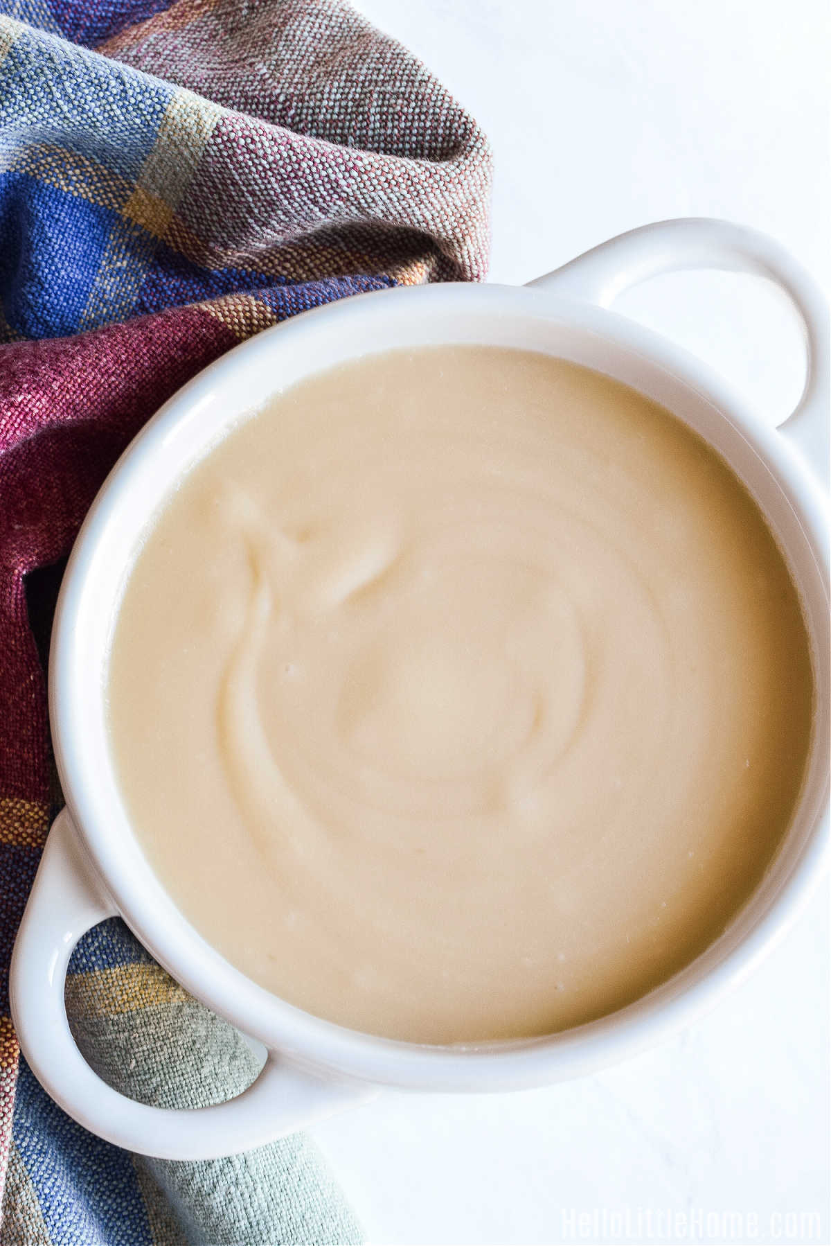 Maple Glaze served in a white bowl next to a plaid napkin.