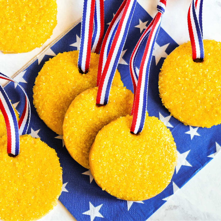 Homemade Olympic Cookies served on a marble table with a blue napkin.