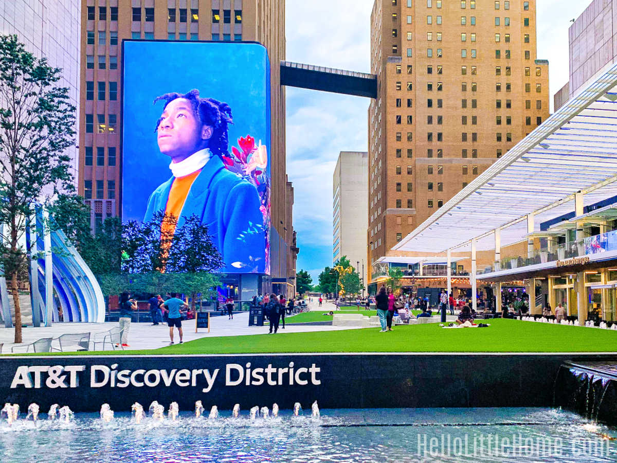 People walking around the AT&T Discovery District in the evening.
