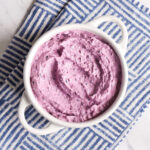 Homemade Blueberry Cream Cheese served in a white bowl.