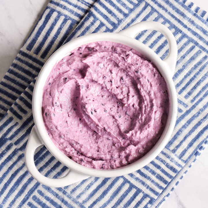 Homemade Blueberry Cream Cheese served in a white bowl.