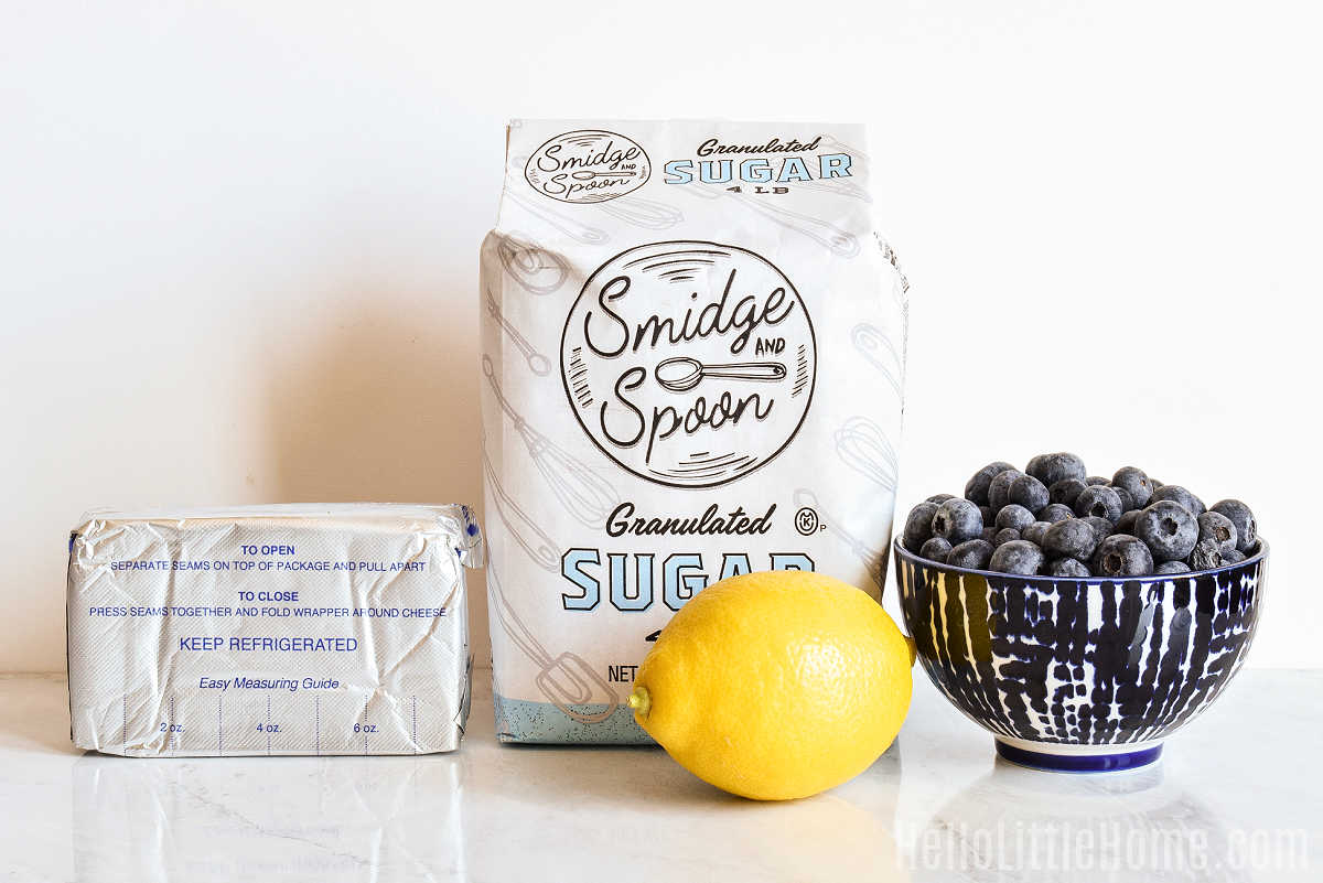Blueberry Cream Cheese ingredients arranged on a marble counter.