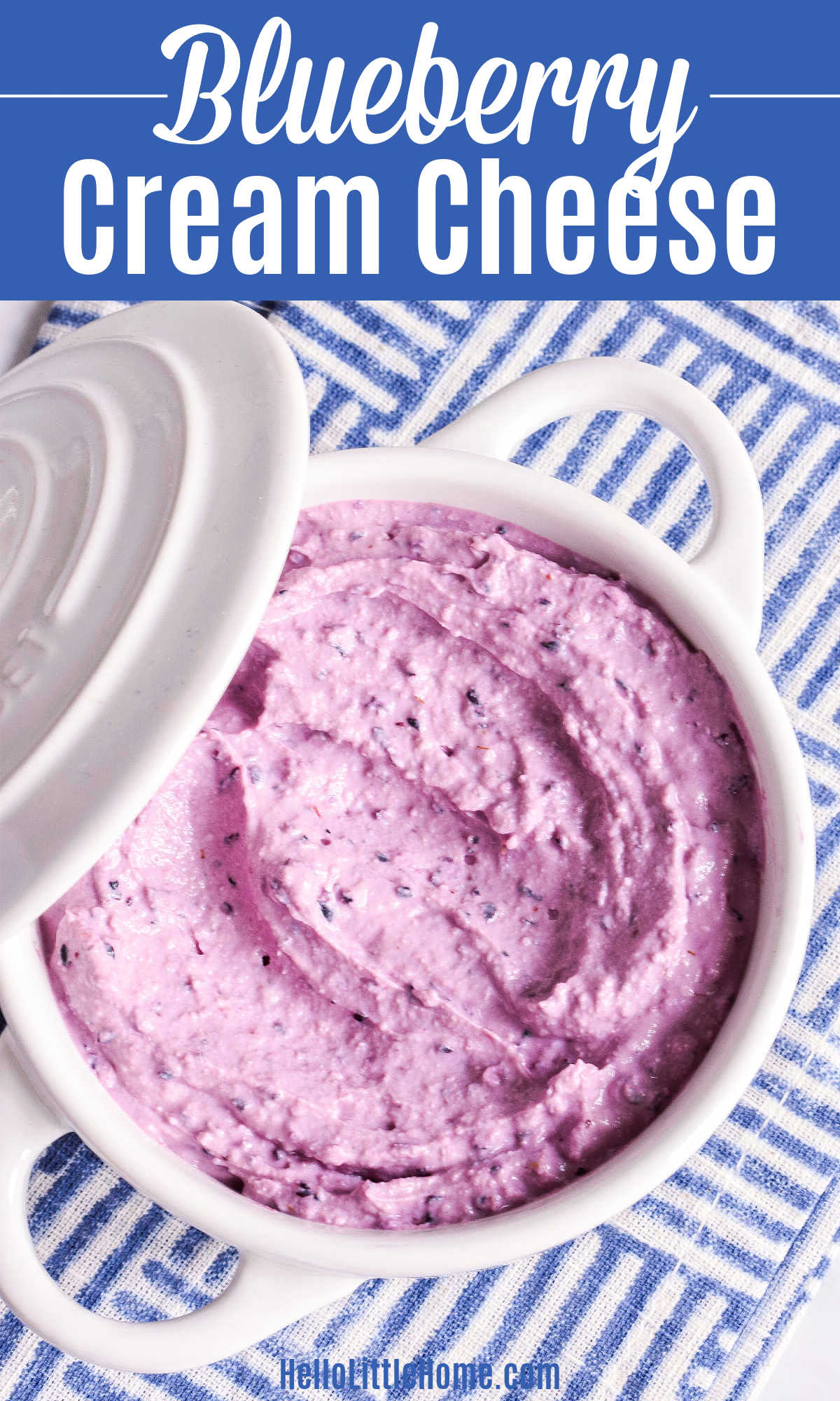 Blueberry Cream Cheese served in a white crock on a striped napkin.