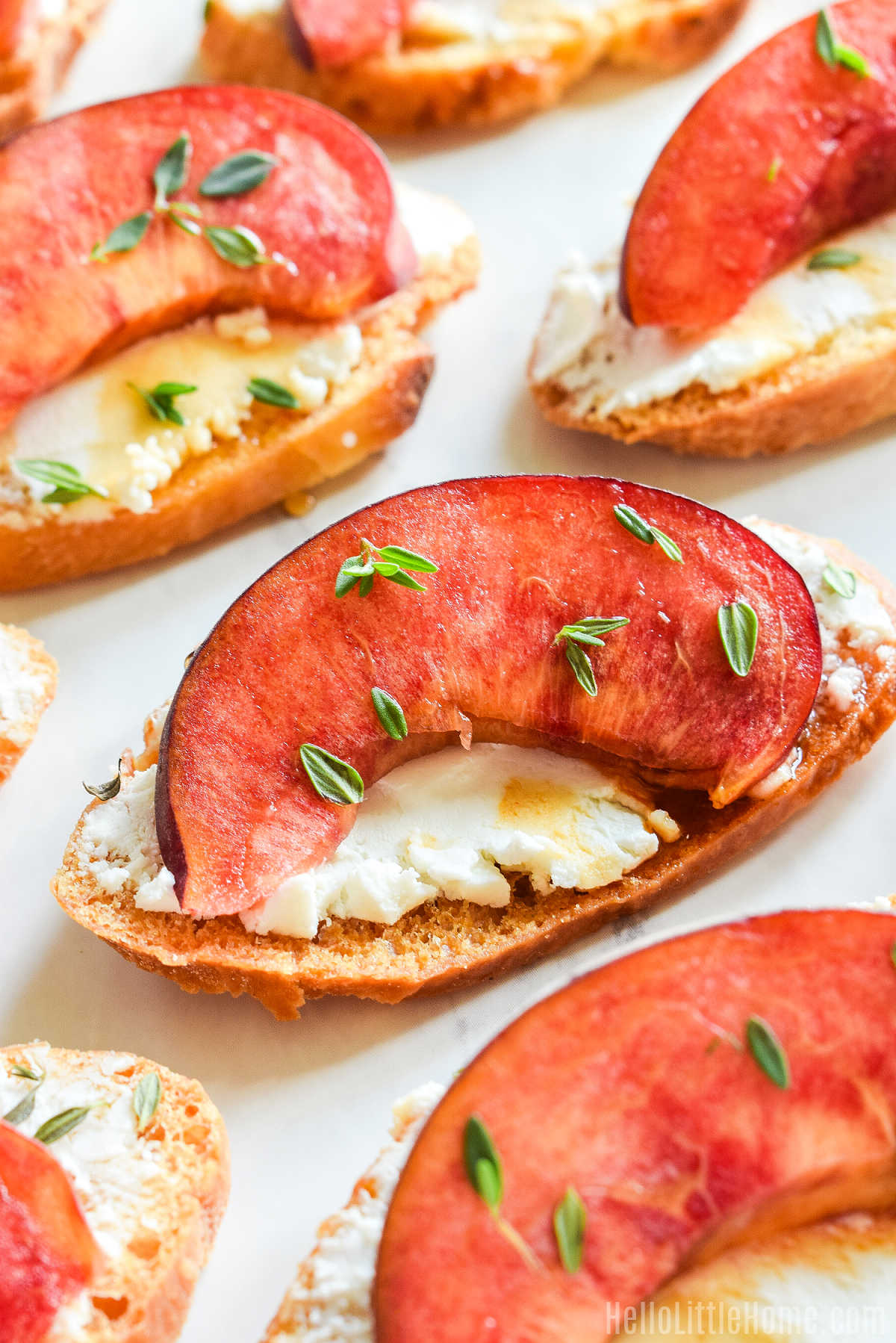 The goat cheese and peach appetizer served on a marble counter.
