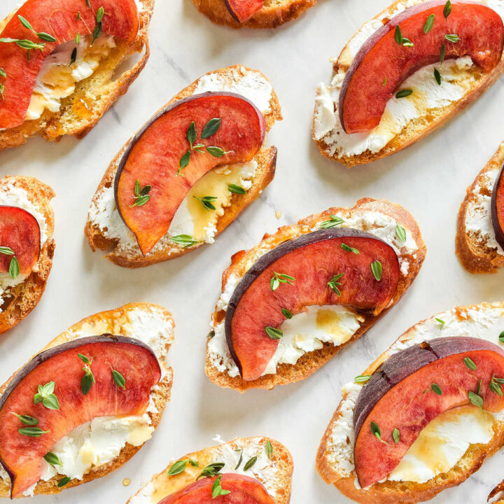 Peach Crostini served on a marble counter.