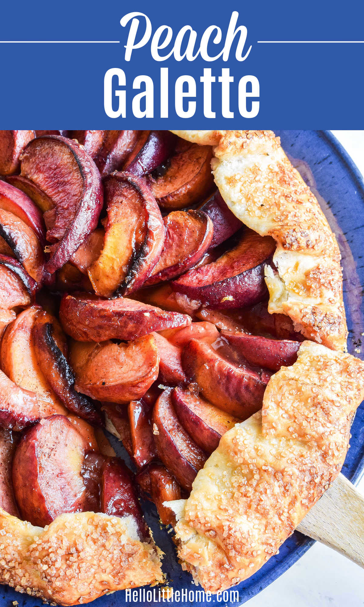 A Peach Galette with a slice being removed with a wood spatula.
