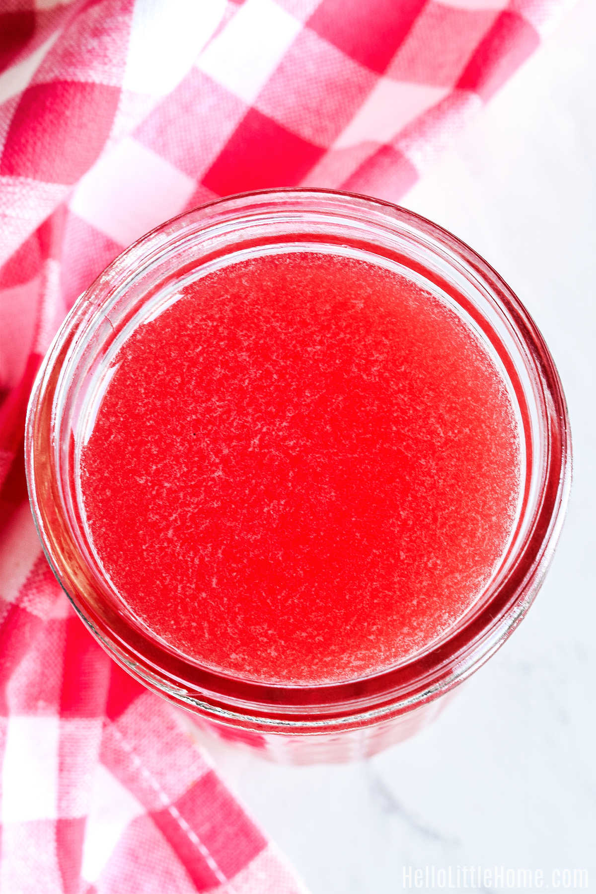 An overhead view of the Watermelon Simply Syrup in a jar.