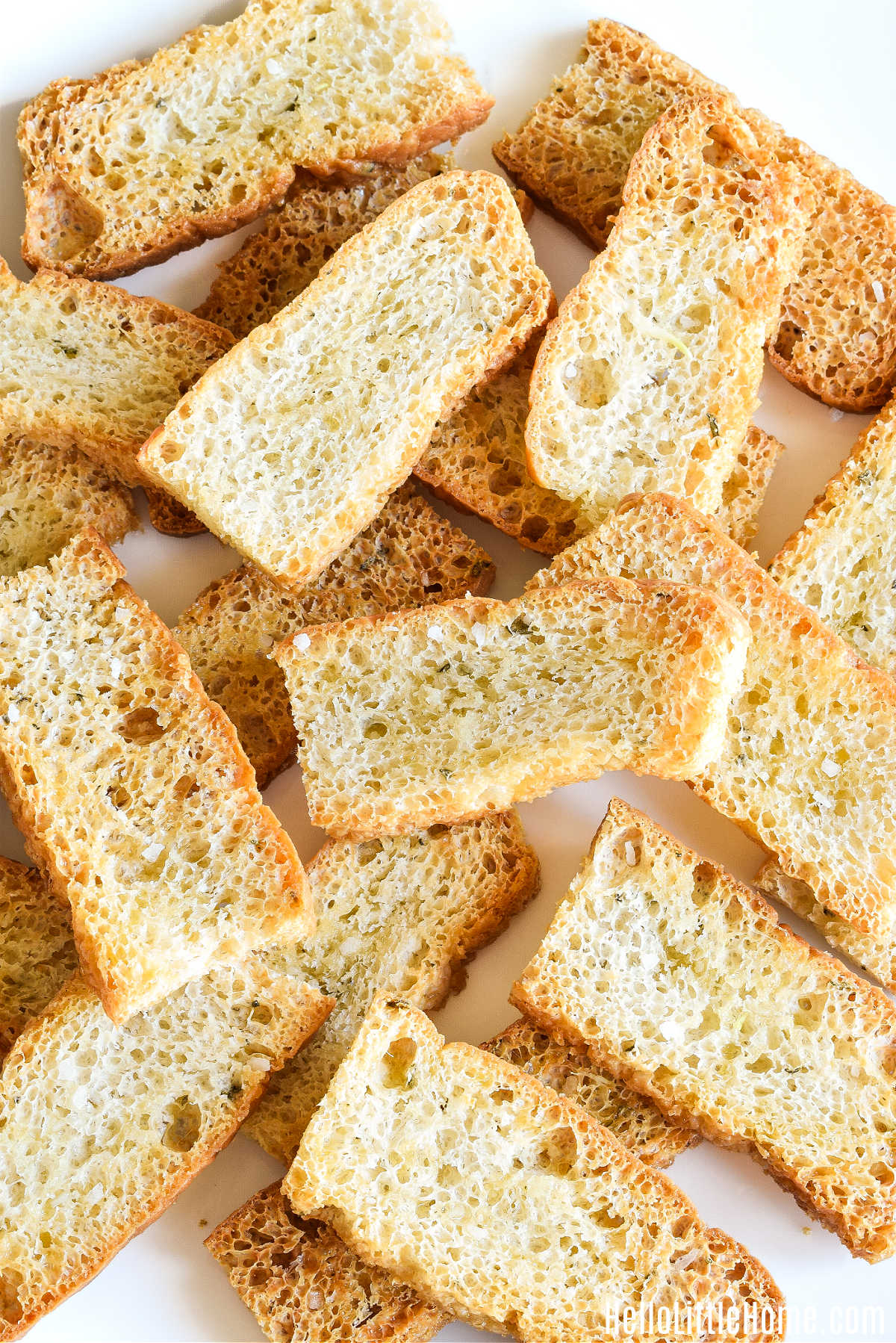 Homemade Focaccia Crostini on a white tray.