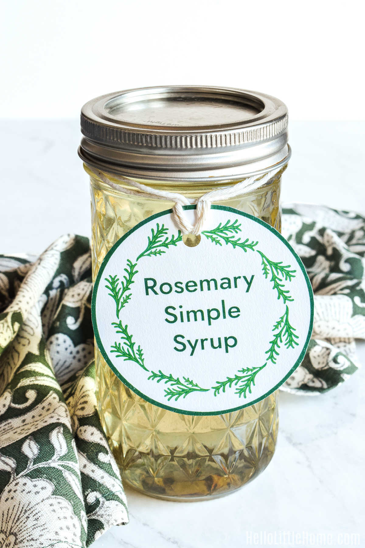 A jar of the homemade syrup decorated with a cute label.