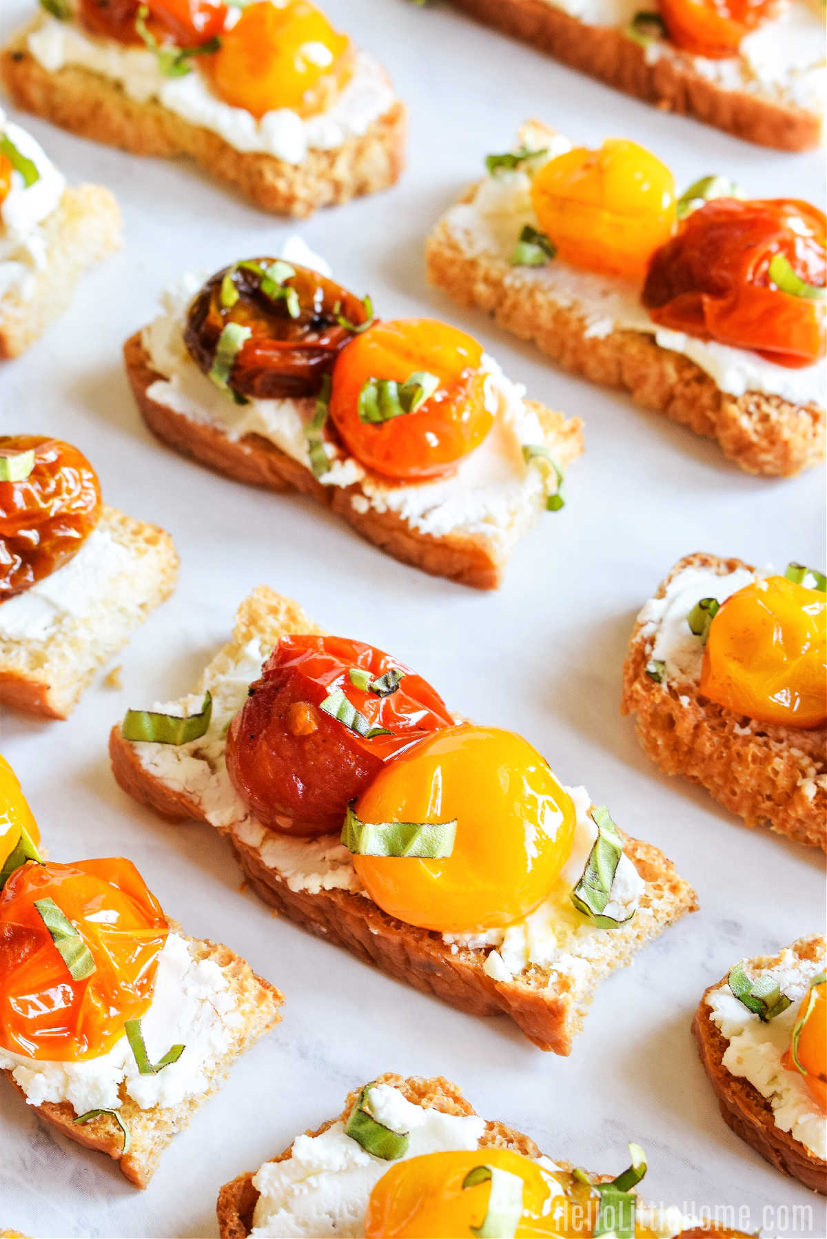 A tray full of the cherry tomato crostini appetizer.