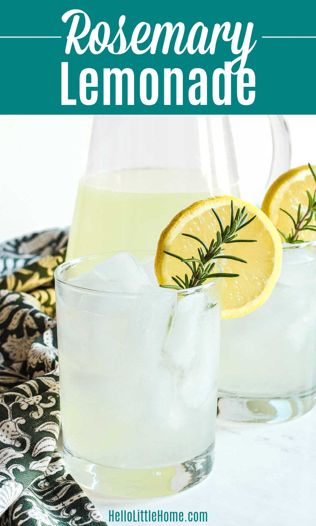 Two glasses of Rosemary Lemonade and a pitcher of the drink on a marble counter.