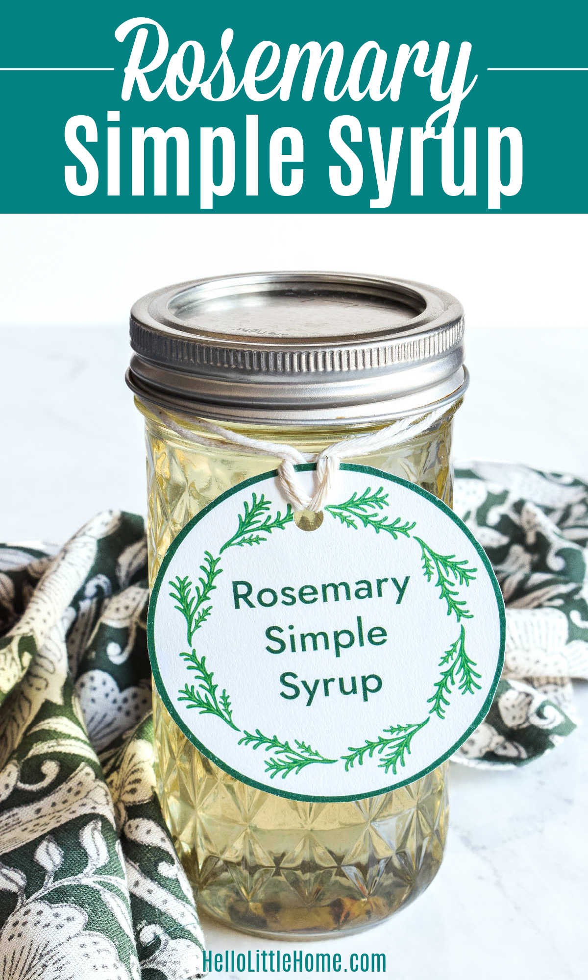 A jar of Rosemary Simple Syrup decorated with a homemade label.