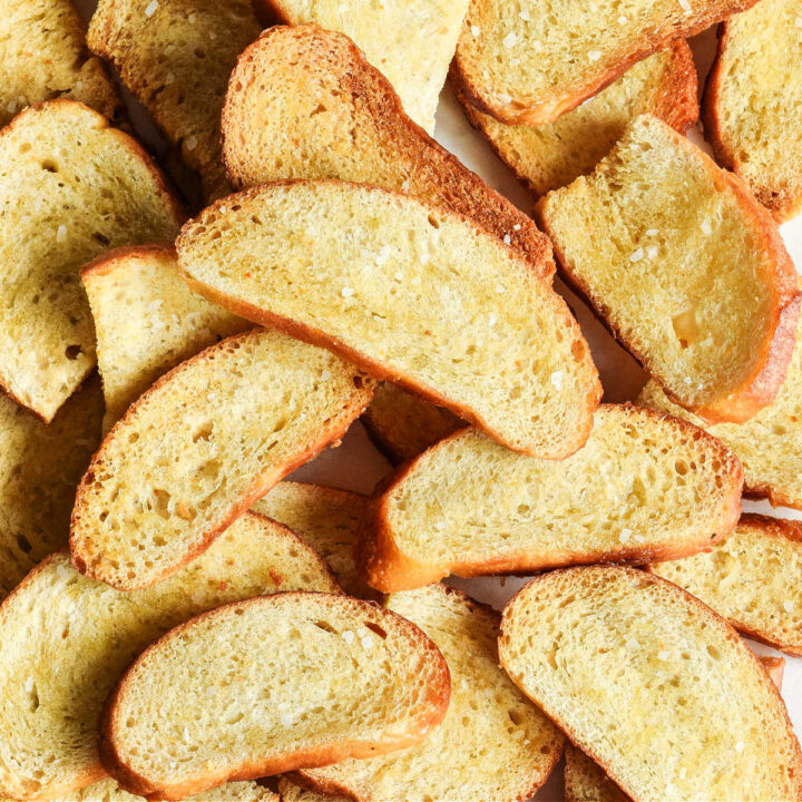 A tray covered with slices of Sourdough Crostini.