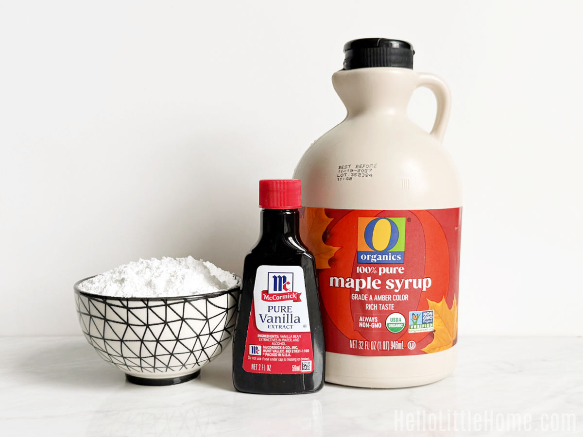 Maple Syrup Glaze ingredients arranged together on a marble counter.