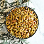 Roasted Pepitas served in a bowl with a napkin.