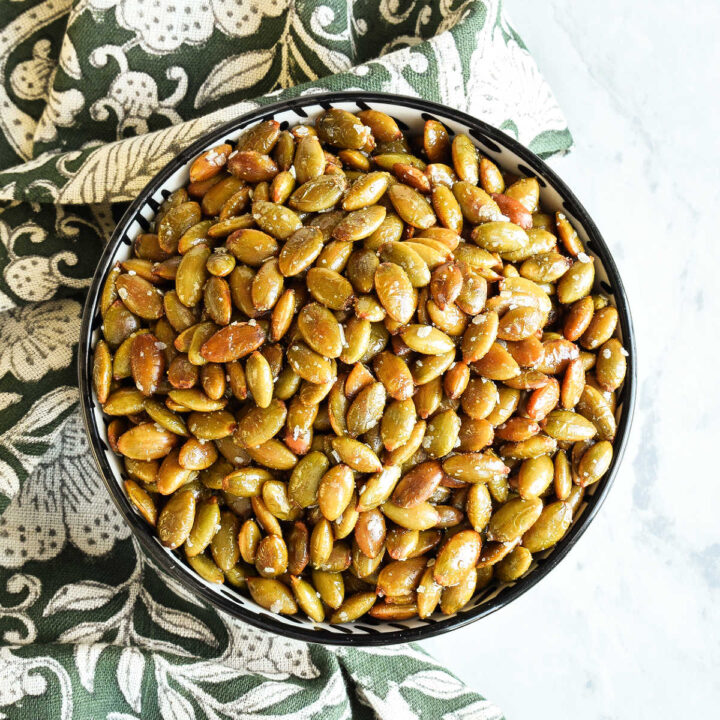 Roasted Pepitas served in a bowl with a napkin.