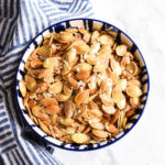 Salted Pumpkin Seeds served in a bowl with a striped napkin.
